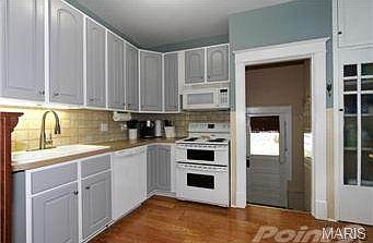 spacious kitchen with tons of cabinets and pantry