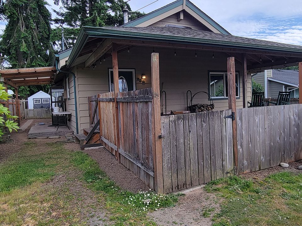 Another view of home with shed in back for storage.