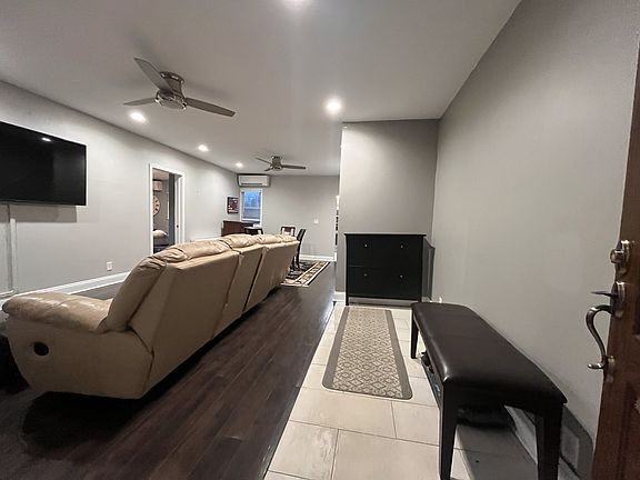 Entrance opens to combined living and dining rooms.