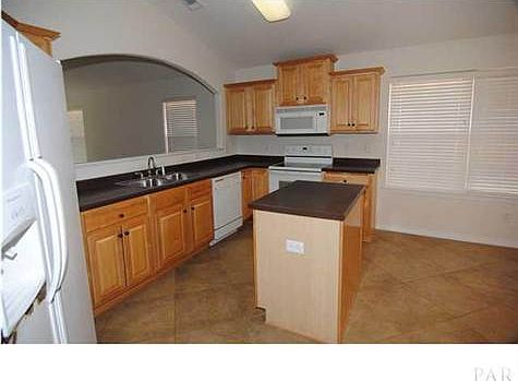 Kitchen with a center island, breakfast nook and pantry