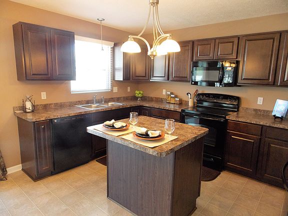 Another view of the ample cabinet and counter space.