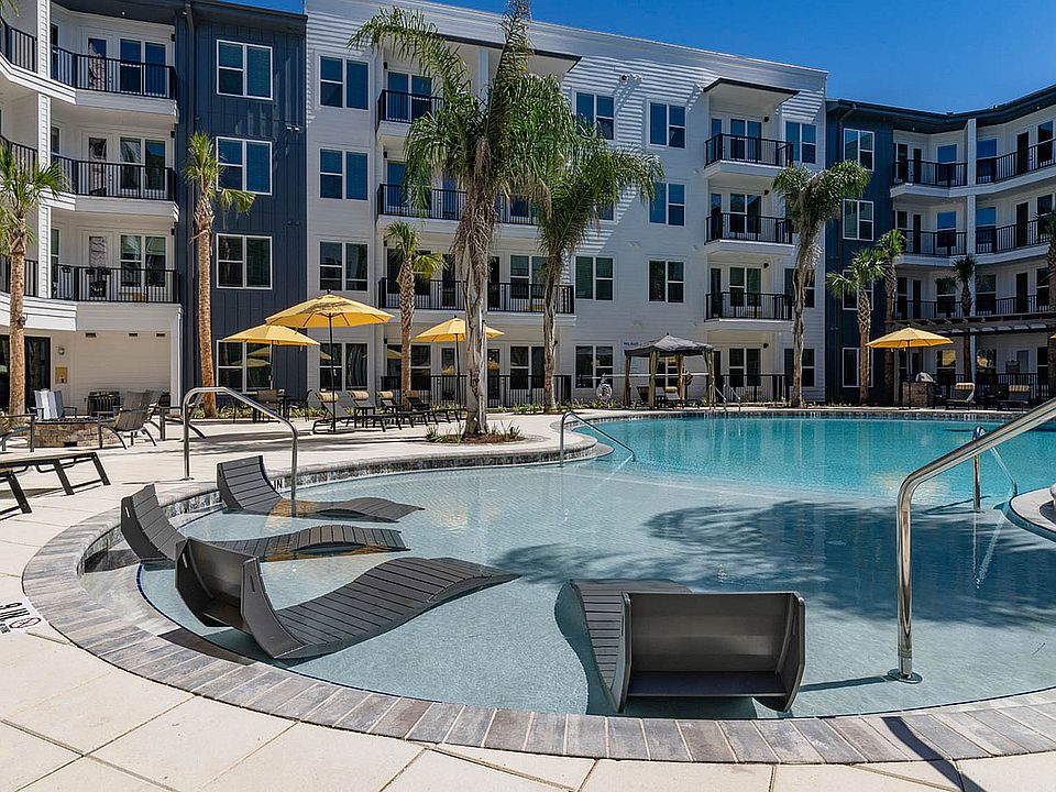 Relax by the poolside at this stunning, modern apartment complex.