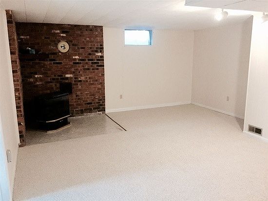 Basement Den with propane stove and new carpet