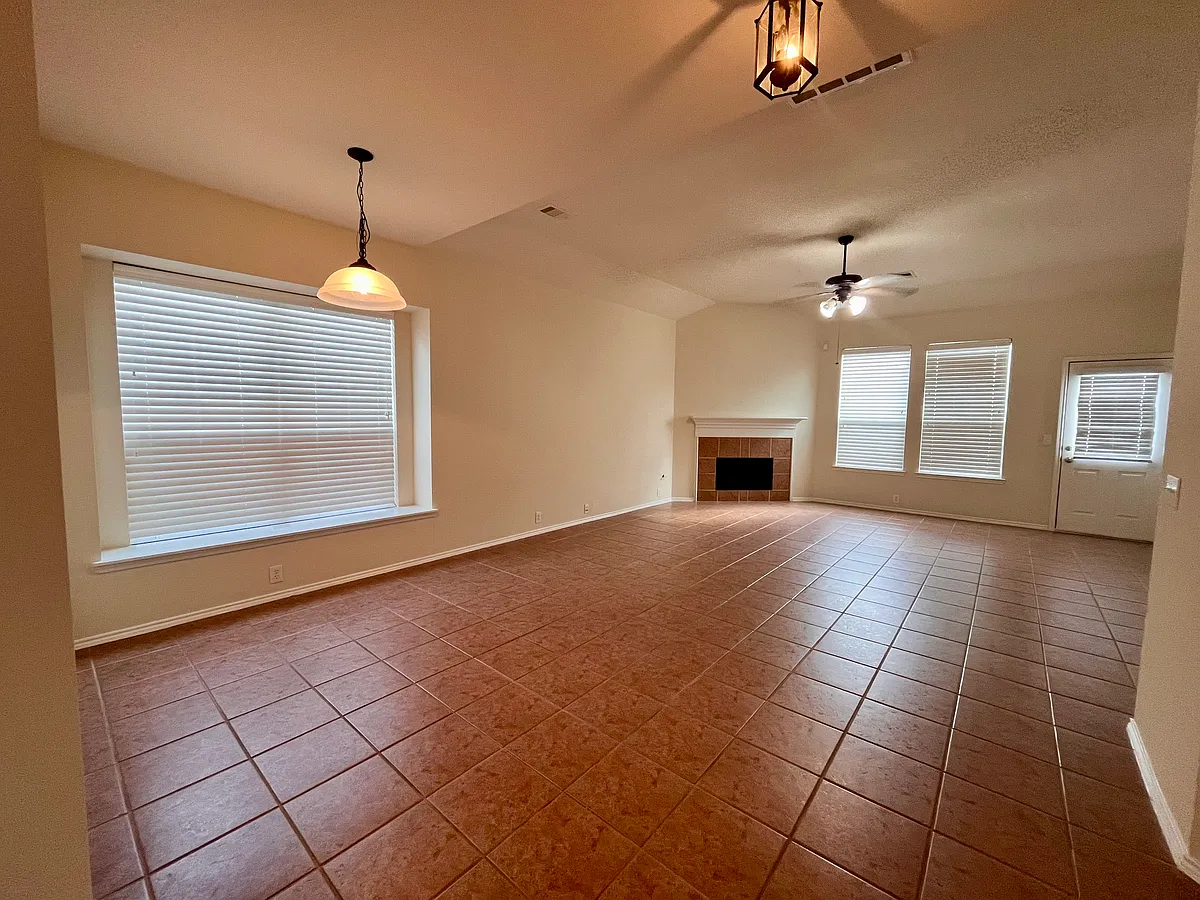 Open space at family and breakfast area with fireplace high ceilings and plenty of natural light - 3514 Leaf Vines Dr