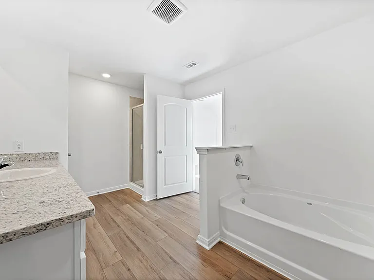 A tub in the master bathroom.