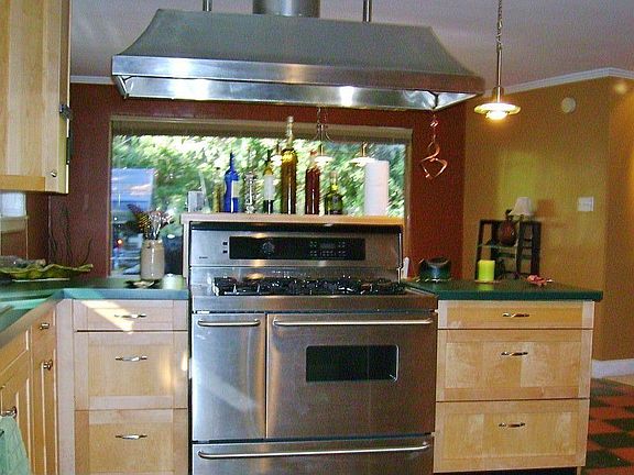 Gourmet Cook's Dream Range & Hood. Family Eating Area is beyond with large picture window.