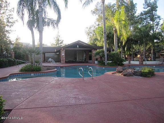 Pool area is located just steps away from the townhome.