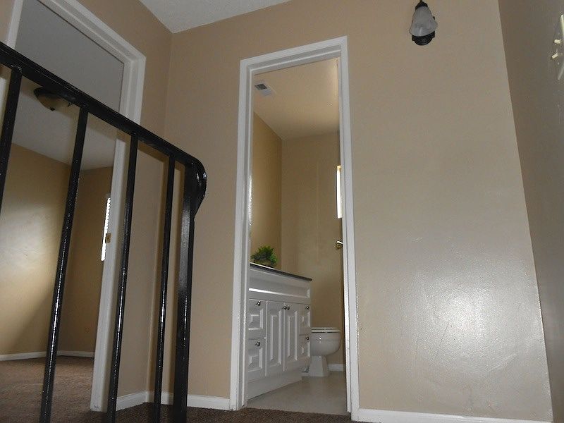 Upstairs bath with newer cabinet and flooring and granite co