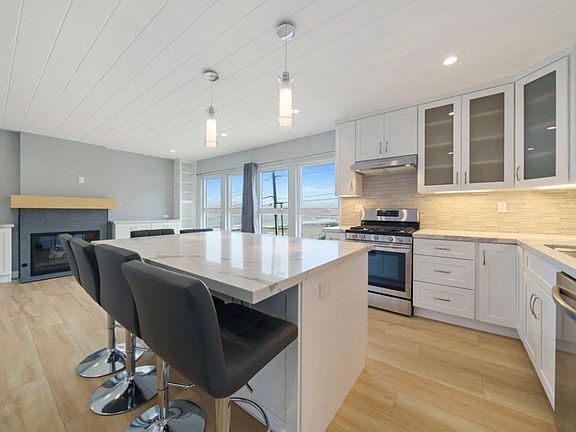Daylight kitchen pic with obstructed ocean view