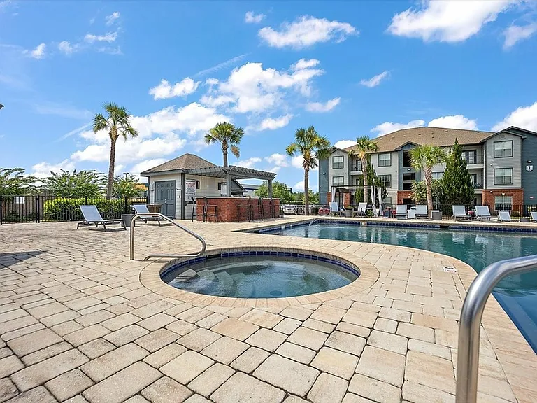 Charming Pool and Hot Tub Area at Eagle Flatts Off Campus Apartments in Hattiesburg, MS