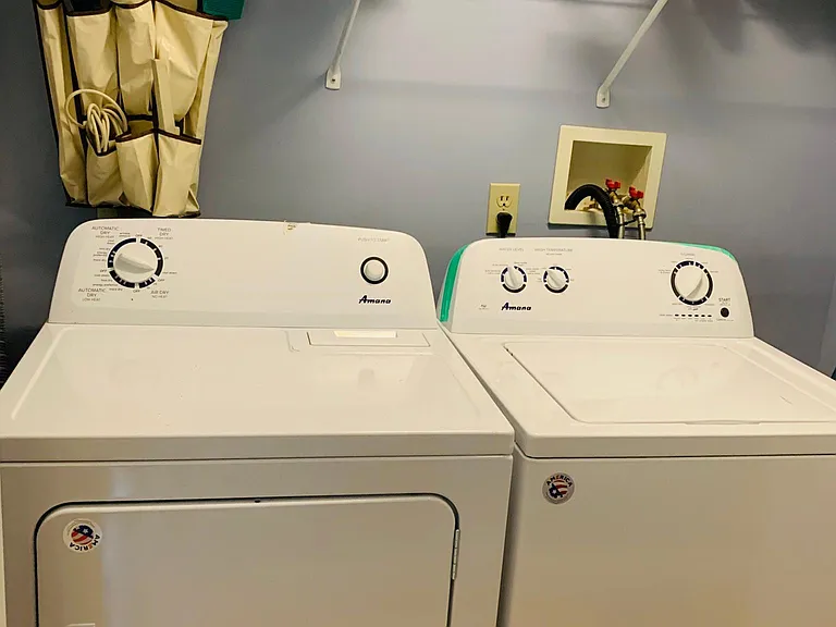 Full sized washer and dryer in the hallway. Detergent and ironing board included!