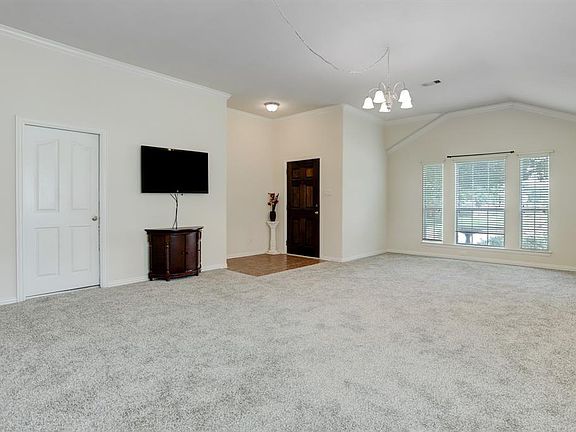 Wall mounted TV and stand to stay with home.