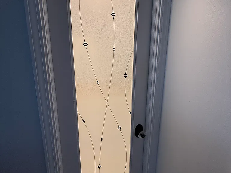 Entrance to MASTER BATHROOM with an illuminated decorative glass privacy door