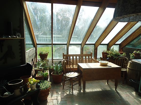 south facing attached greenhouse