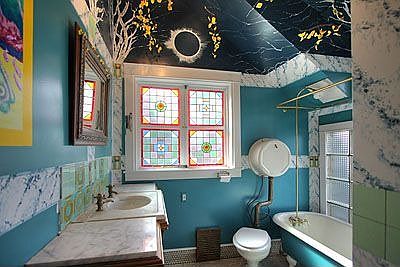 unique bathroon with claw foot bathtub & stain glass windows