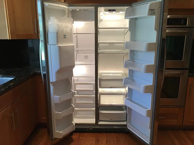 Large side by side refridgerator and freezer.