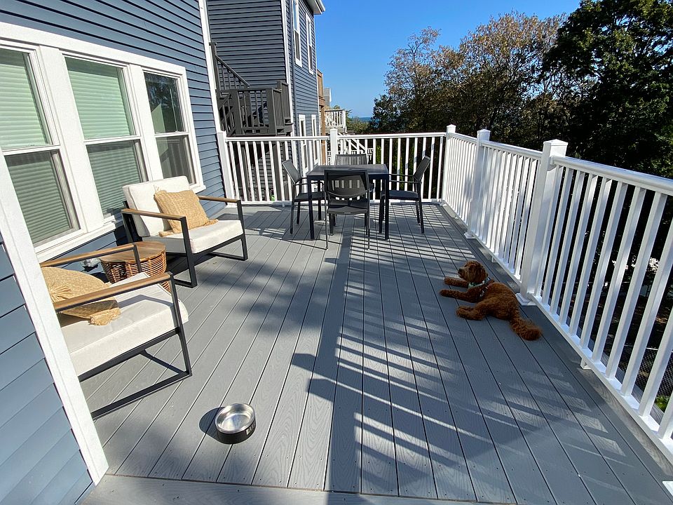 Oversized back roof-deck with sliding door access off of kitchen. Views of the ocean and Boston.