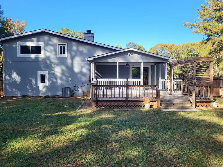 Large Backyard with Double Deck And Sliding Glass Door