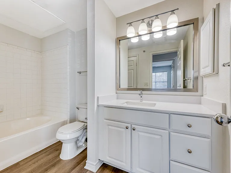Large bathrooms with ample storage space.