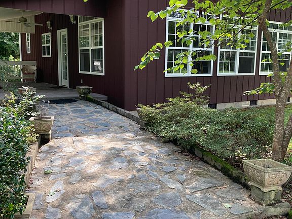 Private entrance on wooded lot.