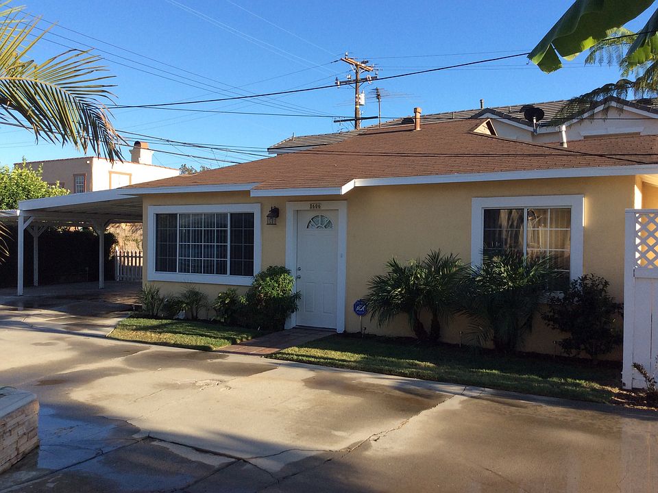 This bungalow has front yard, carport and backyard.