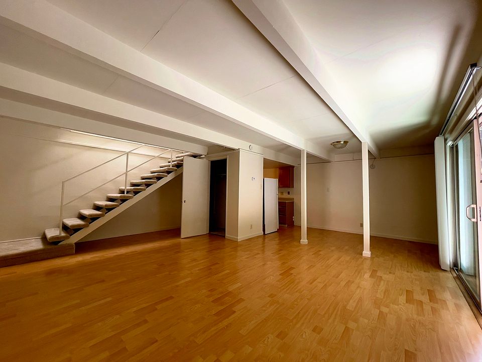 Townhouse living room. Nearly all have wood flooring like this, with carpeting in the upstairs bedrooms.