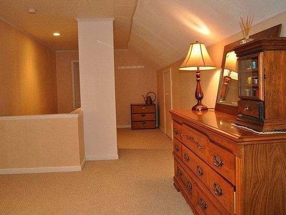 Finished upstairs with berber carpet and additional storage.