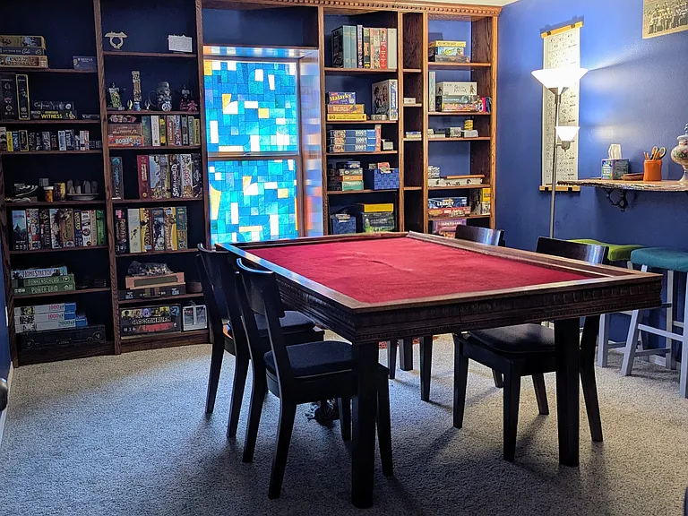 12' x 14.5' Upstairs bedroom with built-in adjustable shelving. Clearly also functions as a game or hobby room. 4.5' x 6' walk-in closet.