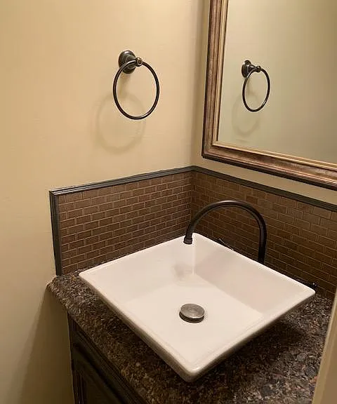 Half bath on first floor across from laundry room