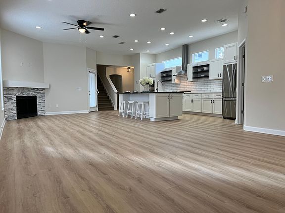 View from dining area to family room and kitchen