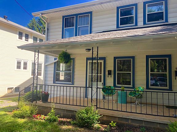 Unit includes the two stories on the left of the builiding - downstairs the front door and windows on both sides of front door and upstairs double windows are in front bedroom and small window leads up to attic stairs.