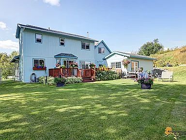 This is our home pictured from the corner of the back yard. The tiny home has been upgraded since this picture and is a separate rental with different windows in consideration of privacy.