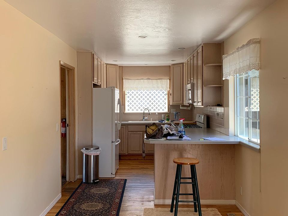 Kitchen view from dining room. Lots of light! Access to garage near kitchen