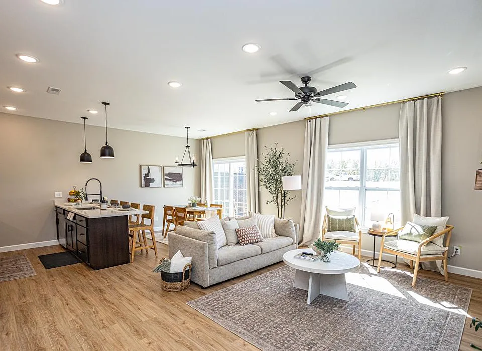 The living room area blends naturally with the dining area and kitchen to create a spacious and open floor plan, perfect for entertaining and everyday living.