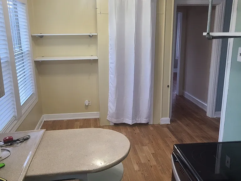 Dining area from kitchen with pantry closed.