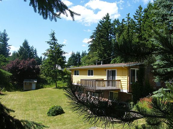 Back of home, deck off living rm, 1/2 acre lot