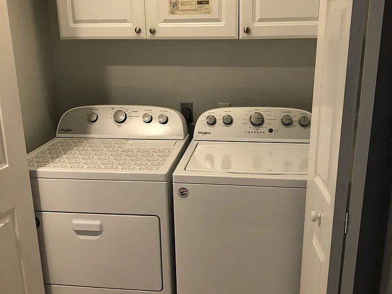 Laundry washer and dryer inside the unit.