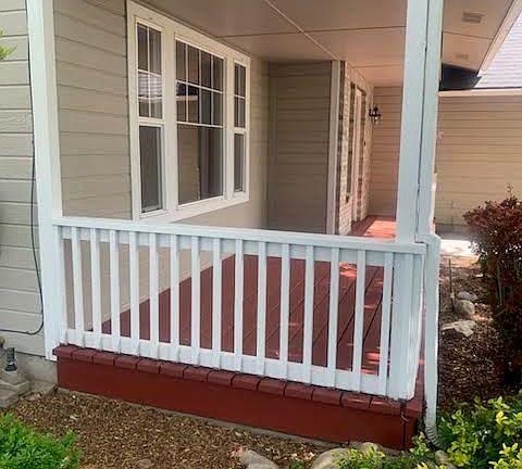 Front covered porch newly painted.