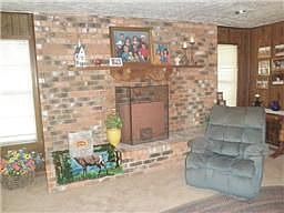 Look at this beautiful brick fireplace! Enjoy staying warm by this gorgeous fireplace!