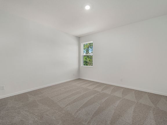 The master bedroom is spacious and has a walk in closet and bathroom attached