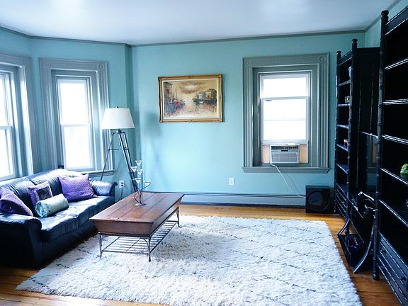 The living space provides amble room to fit couches or a large sectional, a coffee table, several bookcases, and an entertainment center with plenty of room to spare. A compact 8000 BTU window AC provides cooling for the living/dining area.