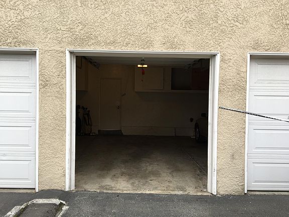 1 assigned space in shared garage with door remote control, extra storage included.