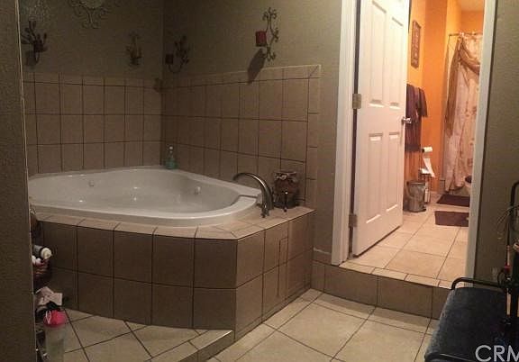 master bedroom Jacuzzi tub and bathroom with shower