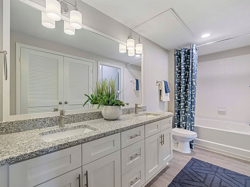Upgraded Apartments - Contemporary bathrooms with framed mirrors