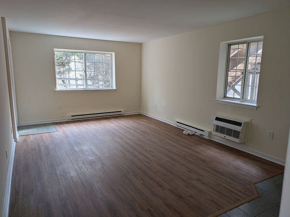Living Room with wall unit air conditioner.