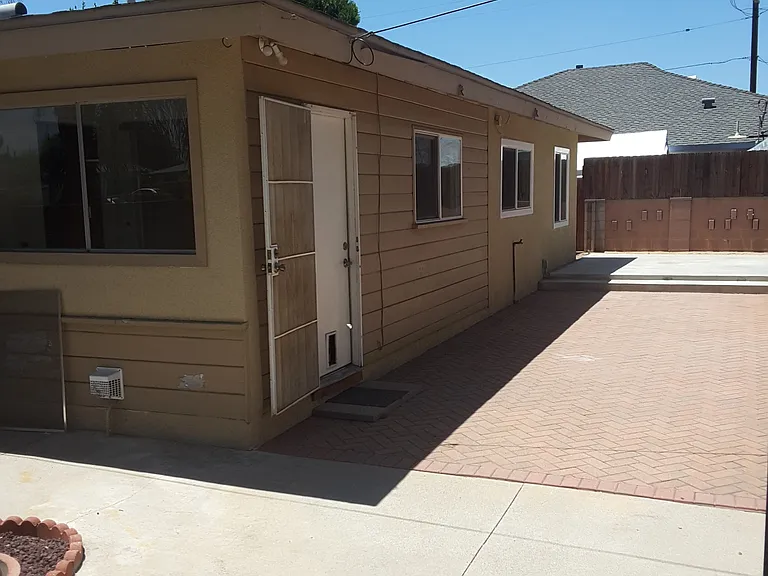 Back yard areas: I didn't want to upload each area, but in the far back you'll find a big cemented area. In the middle part there is a good size area with pavers, and on the front side is also cemented where you can enjoy the fire pit, it's also good size