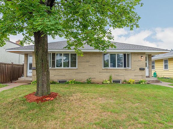 Side by side duplex with new roof 2018 and brick and stucco exterior.