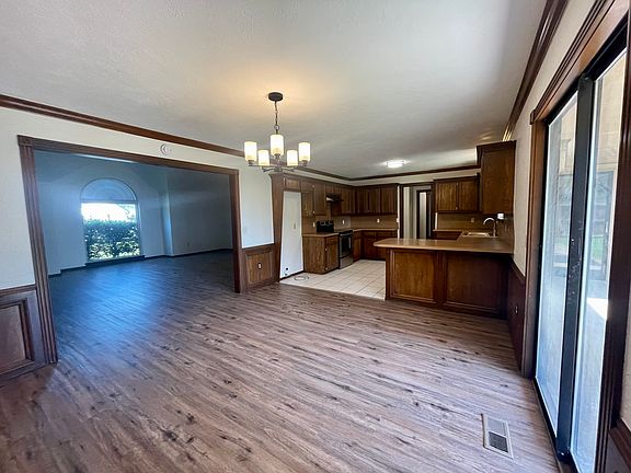 Dining and kitchen with view into the living