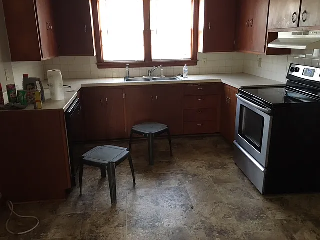 Kitchen sink , oven, cabinets