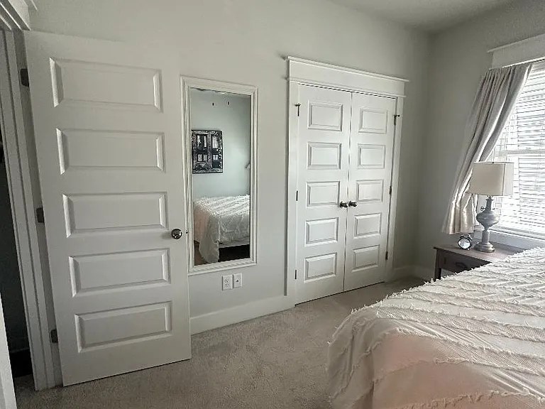2nd bedroom- double doors to walk in closet